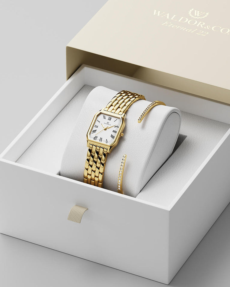 A square womens watch in 22k gold plated 316L stainless steel from Waldor & Co. with white Diamond Cut Sapphire Crystal glass dial. Seiko movement. The model is Eternal 22 Bellagio