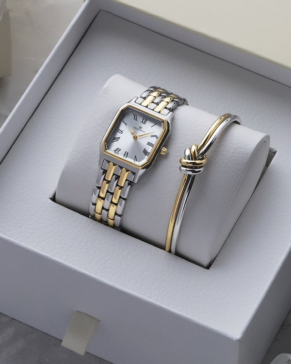 lifestyle_image,A square women’s watch and double knot bracelet in gold and silver from Waldor & co. The model is Eternal 22 Bellagio & Dual Knot Bangle.