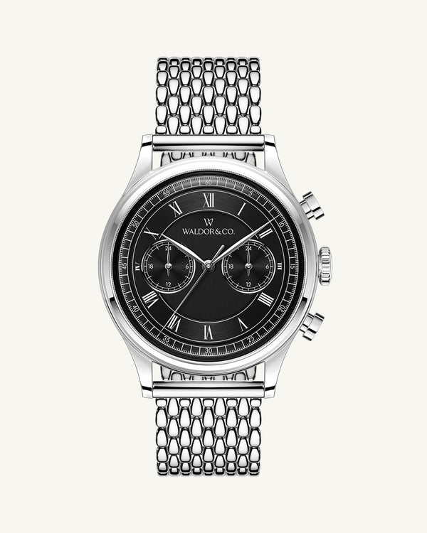 A round mens watch in rhodium-plated silver from Waldor & Co. with black sunray dial and a second hand. Seiko movement. The model is Avant 42 Sardinia 42mm.