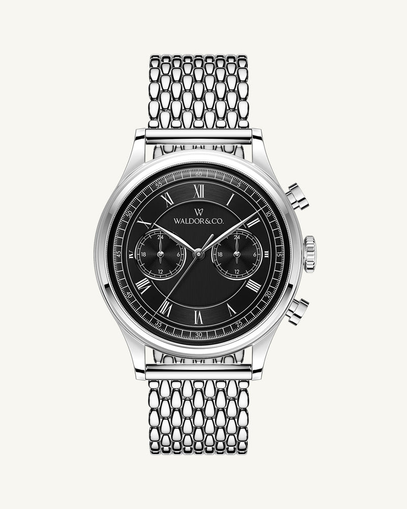 A round mens watch in rhodium-plated silver from Waldor & Co. with black sunray dial and a second hand. Seiko movement. The model is Avant 42 Sardinia 42mm.