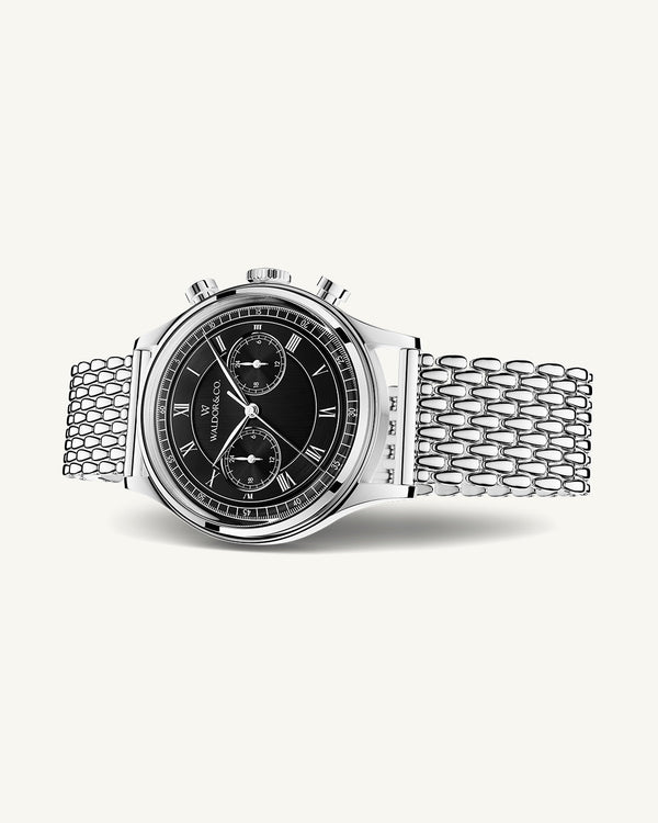 A round mens watch in rhodium-plated silver from Waldor & Co. with black sunray dial and a second hand. Seiko movement. The model is Avant 42 Sardinia 42mm.