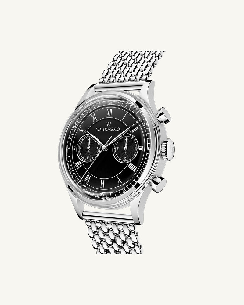 A round mens watch in rhodium-plated silver from Waldor & Co. with black sunray dial and a second hand. Seiko movement. The model is Avant 42 Sardinia 42mm.