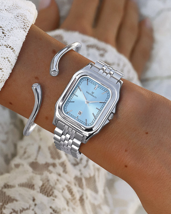  A polished stainless steel bangle from Waldor & Co. One size. The model is Delight Bangle.