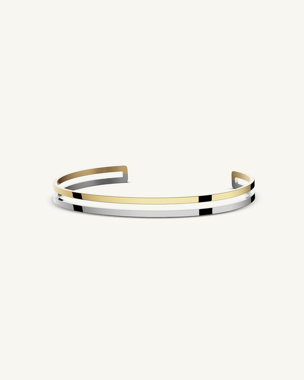 A Bangle in 14k gold plated 316L stainless steel from Waldor & Co. One size. The model is Dual Bangle Polished.