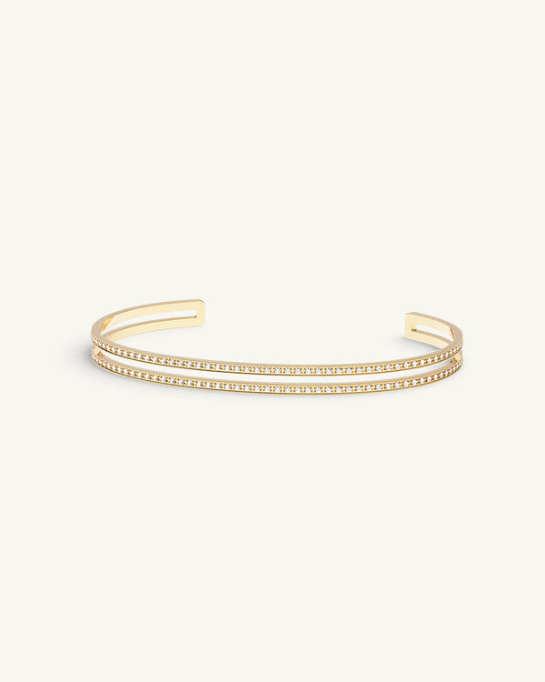 A Bangle in 14k-gold plated 316L stainless steel from Waldor & Co. One size. The model is Dual Diamond Bangle Polished.