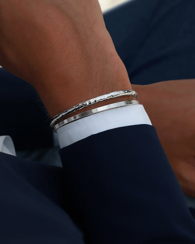 A Round Bangle in 925 Sterling Silver from Waldor & Co. The model is Opal Bangle Sterling Silver