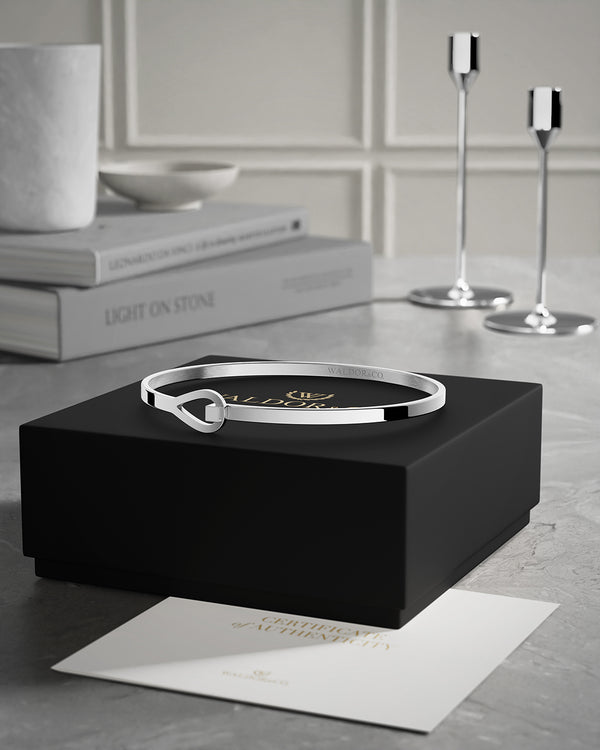 A Bracelet in polished Silver plated-316L stainless steel from Waldor & Co. The model is Signature Bracelet Polished.