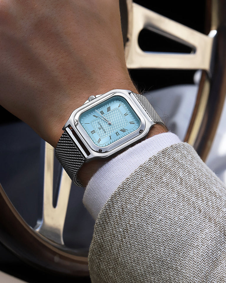  A square mens watch in silver from Waldor & Co. with light blue dial. Seiko movement. The model is Montel 40 Camogli.