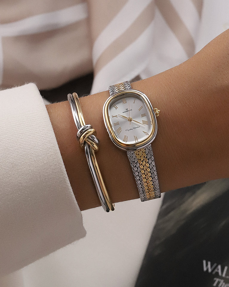  An ellipse shaped women’s watch in Rhodium-plated 316L stainless steel from Waldor & Co. with silver sunray dial in brass with Greta Garbo's signature. Mineral glass with sapphire crystal coating. Seiko movement. The model is Garbo 24 Stockholm.